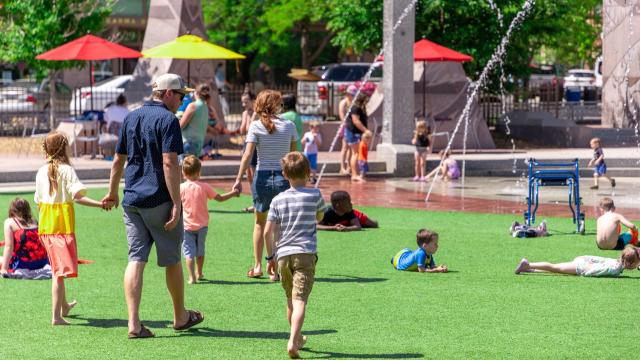 Family walking through Main Street Square 