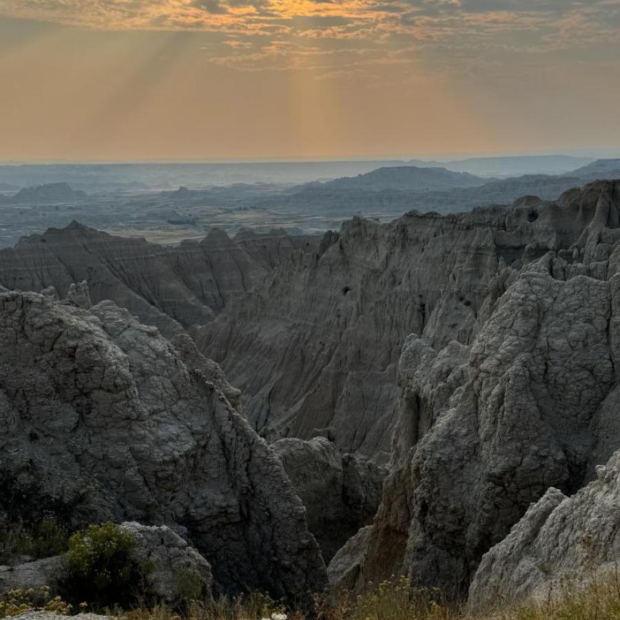 Badlands through a Smokey sky.